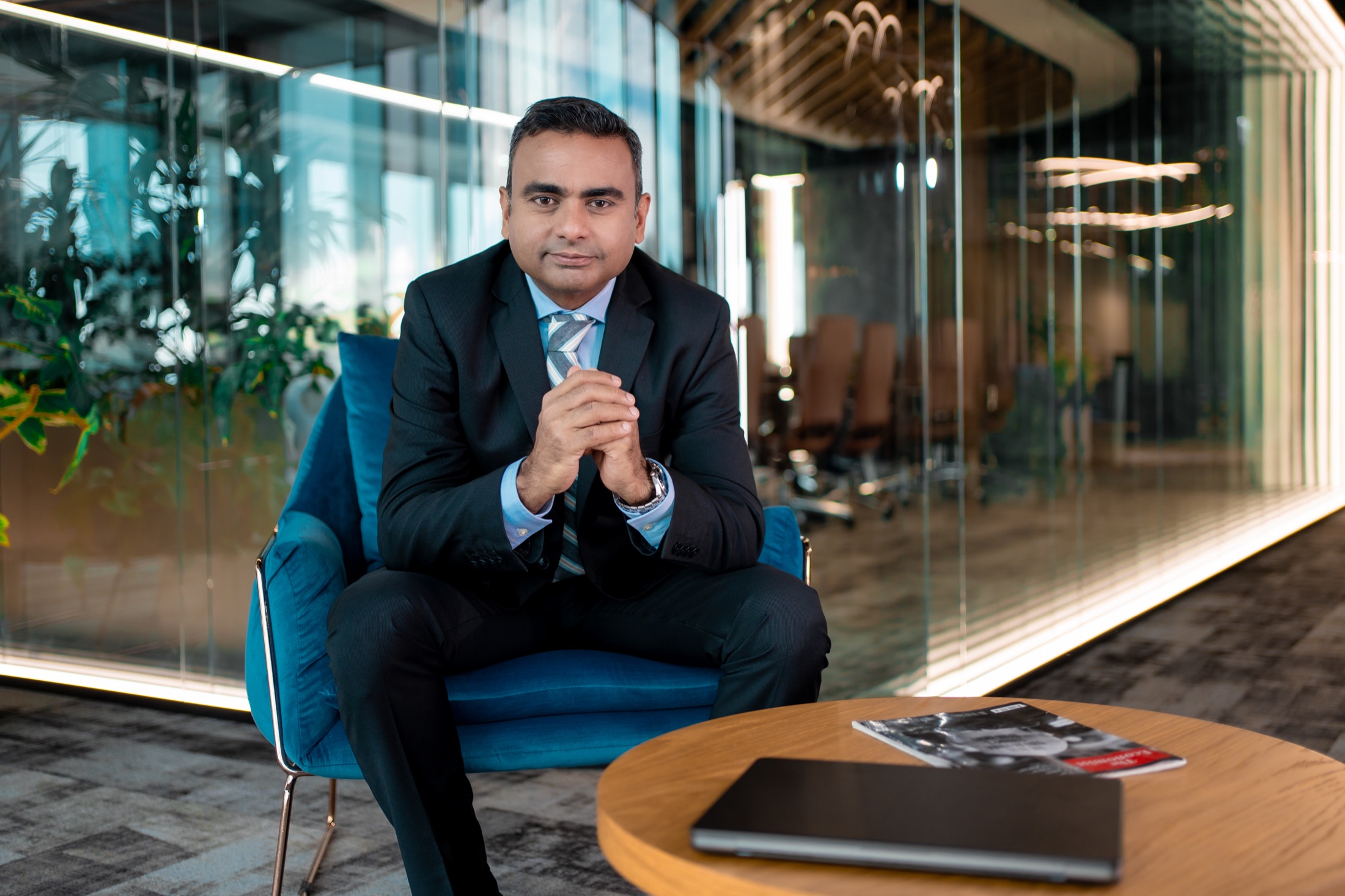 Vivek Bakshi seated in a modern workplace